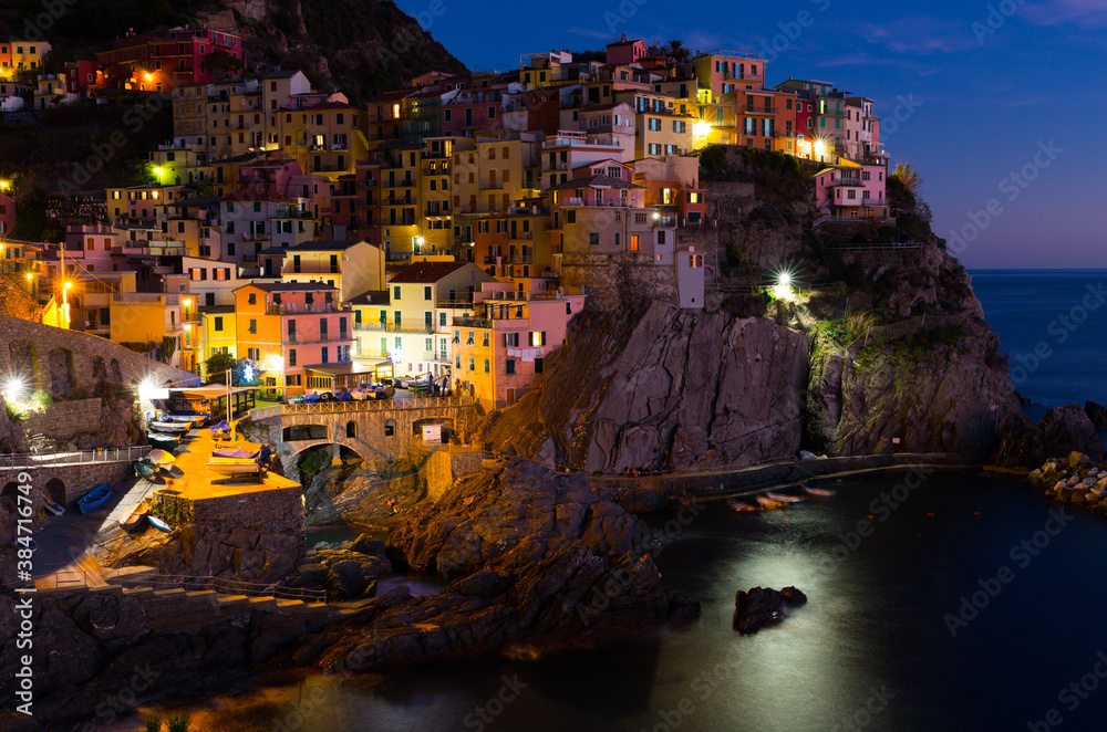 View on night light of Manarola in the province of La Spezia in Italy outdoors.
