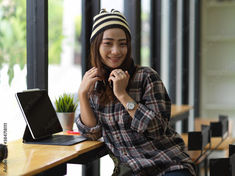 Portrait of female teenager smiling and looking into camera Portrait of female teenager smiling and looking into camera