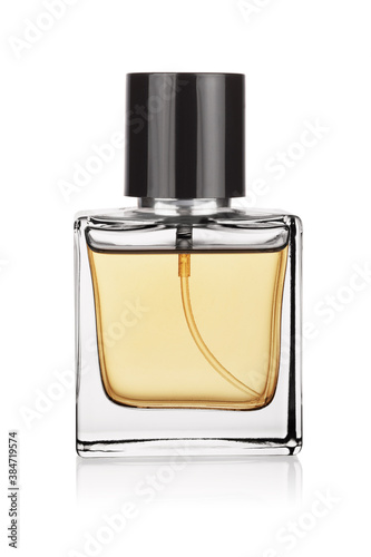 Elegant transparent bottle of yellow perfume isolated on a white. photo