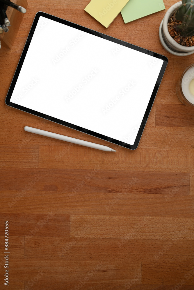 Wooden table with tablet include clipping path, stationery and copy space Wooden table with tablet include clipping path, stationery and copy space