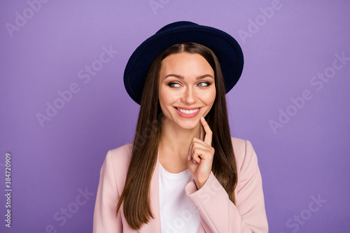 Portrait positive cheerful girl touch cheek finger look copyspace think thoughts decide great funky weekend free time decisions solution wear pastel clothes isolated violet color background