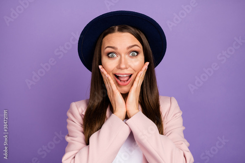 Portrait of astonished cheerful funky lady girl see wonderful black friday news impressed touch hands cheeks scream wear modern clothes isolated over purple color background