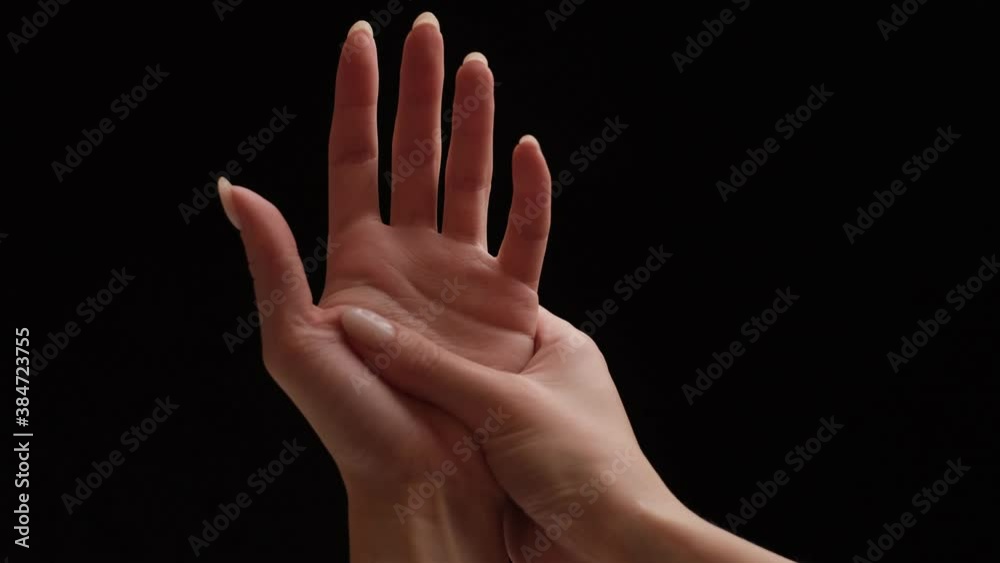 Pain in a female wrist, carpal syndrome, on black background. Point of view in first person Pain in a female wrist, carpal syndrome, on black background. Point of view in first person