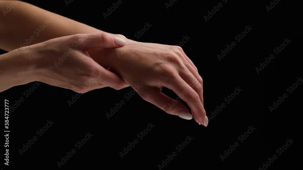 Pain in a female wrist. Woman massages her wrist, carpal syndrome
