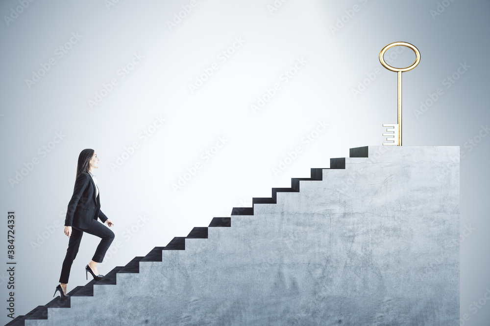 Businessman in suit climbing stairs with golden key - obrazy, fototapety, plakaty 