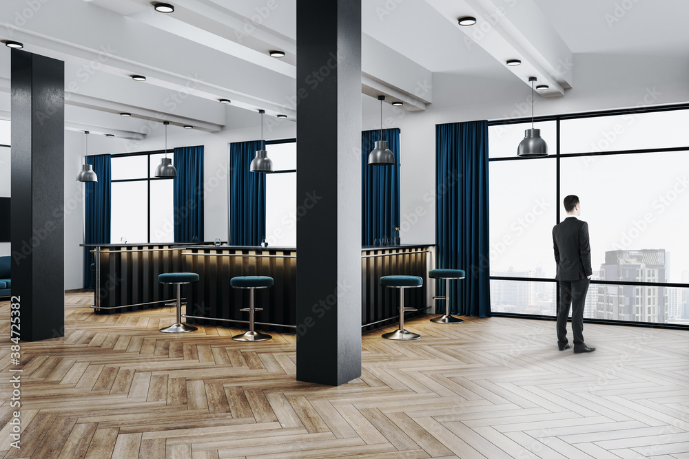 Businessman standing in luxury office hall with bar counter - obrazy, fototapety, plakaty 