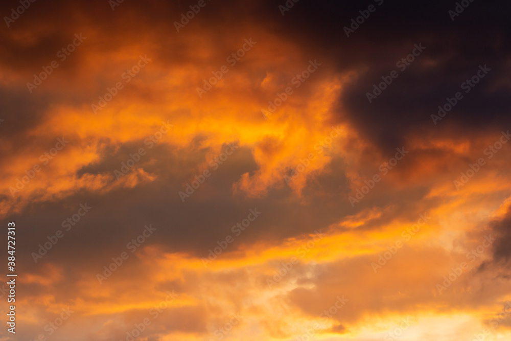 clouds with black clouds at sunset as background
