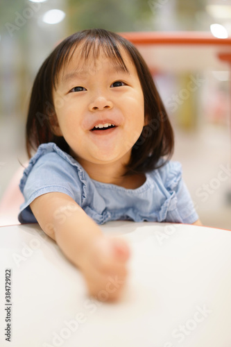 Close-up of Young adorable asian chinese 3 year old girl playing