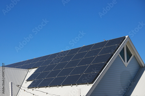 Solar panels on roof of white house