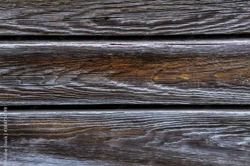 Naklejka premium brown old natural wood planks Dark aged empty rural room. logs inside vintage light warm interior
