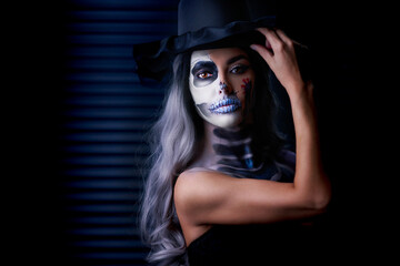 Spooky portrait of woman in halloween gotic makeup