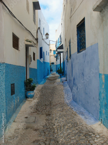 traditional street with white and blue walls in marrakech © raffaellagalvani