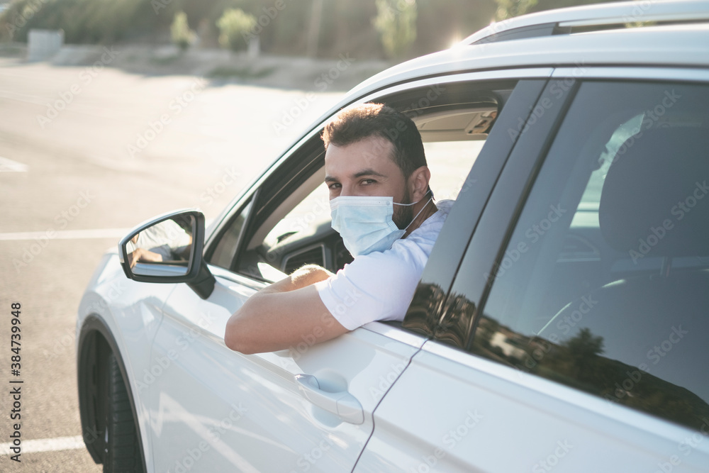 Man driving suv car with surgical face mask Man driving suv car with surgical face mask