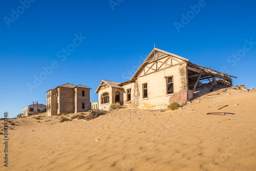 Abandoned colonial houses in Kolmanskop ghost-town in the Namib desert in namibia  © Chris