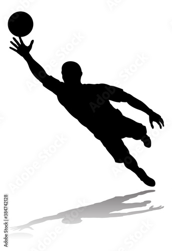 A soccer or football player in silhouette