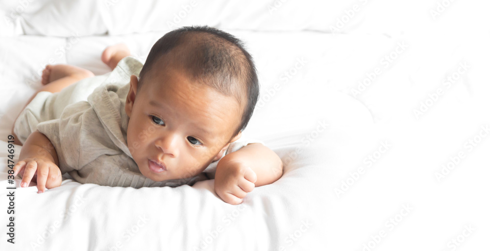 Portrait of happy smile baby relaxing on the bed Portrait of happy smile baby relaxing on the bed