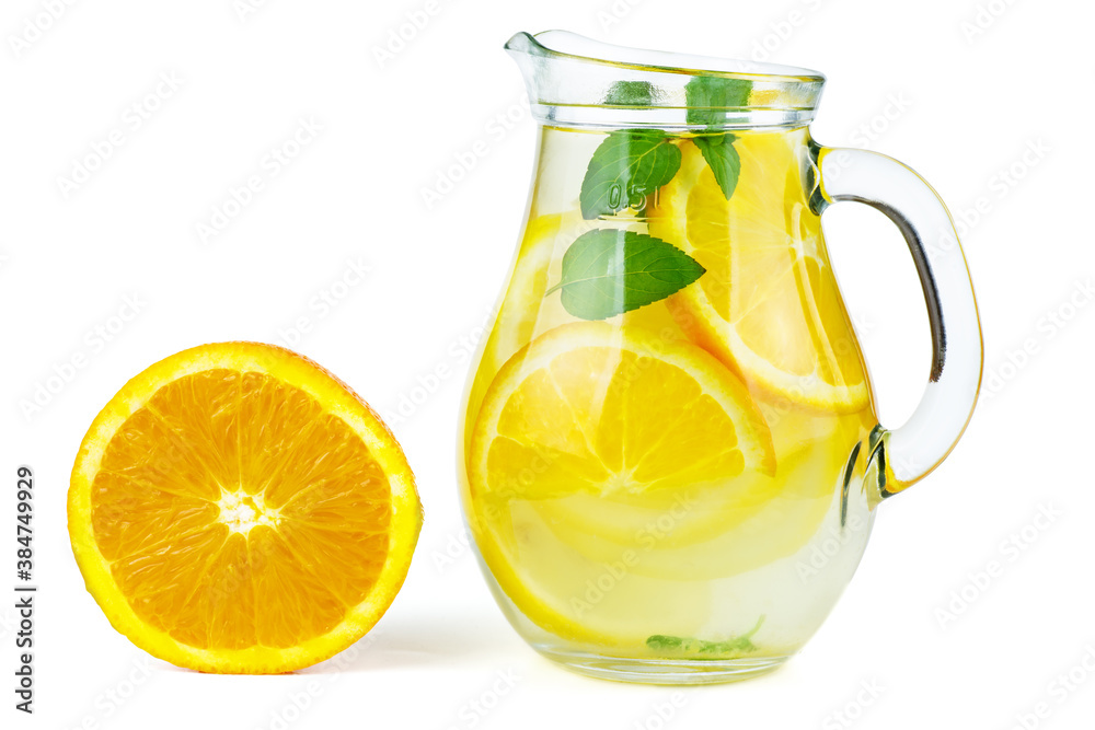 Glass jug with lemon water (or alcohol), slices and mint Glass jug with lemon water (or alcohol), slices and mint