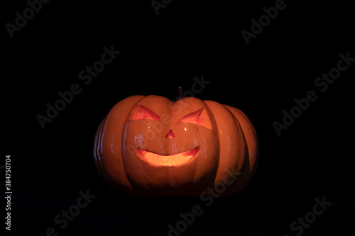 Halloween pumpkin on black background © yasin