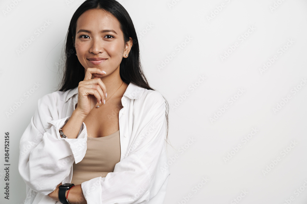 Beautiful happy asian woman smiling and looking at camera Beautiful happy asian woman smiling and looking at camera