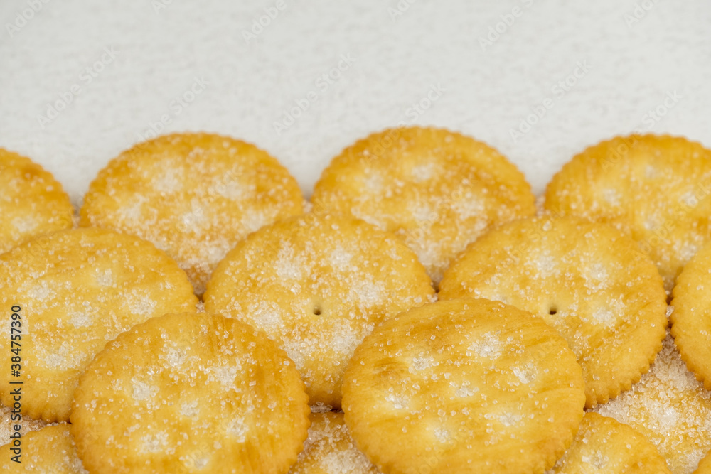 Pile of round cracker with sweet sugar isolated on white background Pile of round cracker with sweet sugar isolated on white background