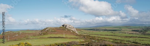 View of Garn Fechan taken from Garn Mawr - twin iron age hillside forts, the Preseli hills in the distance and the north Pembrokeshire coast