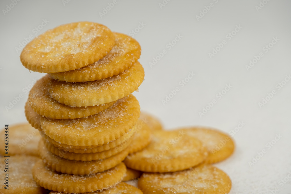 Pile of round cracker with sweet sugar isolated on white background Pile of round cracker with sweet sugar isolated on white background