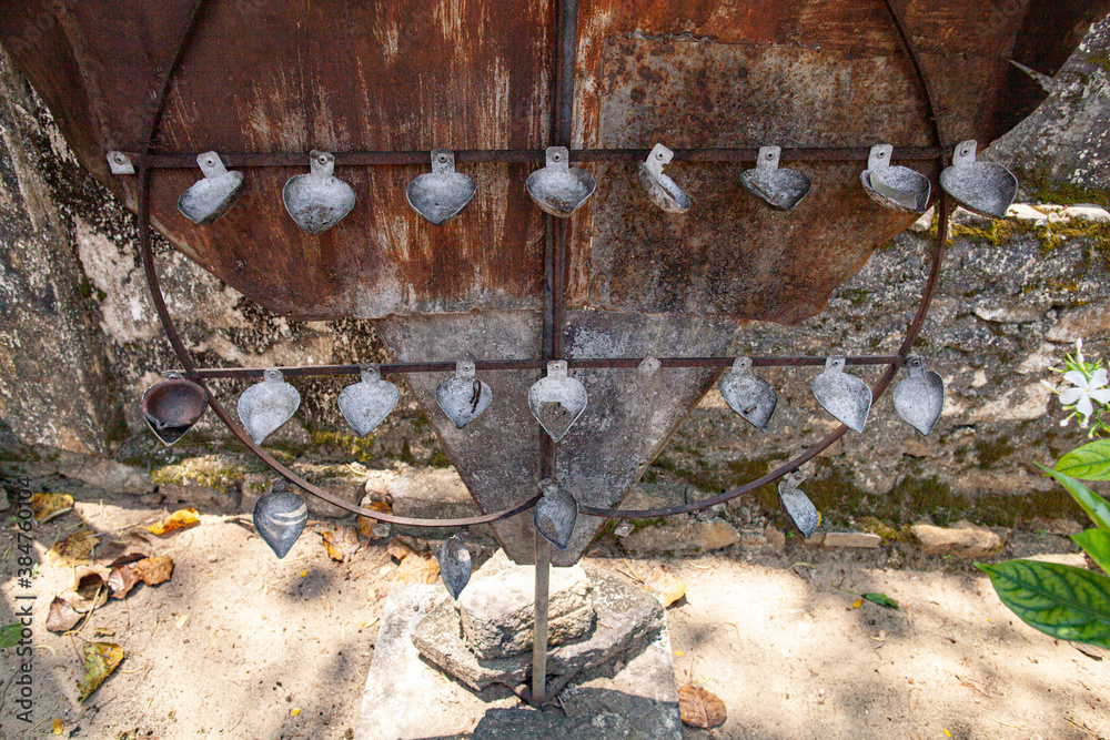 Fototapeta premium Oil lamps made from tablespoons at a temple in Sri Lanka.