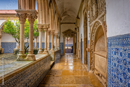 Cloister Hallway With Blue Tiles (Azulejos), Flat Stone Floor and White Columns. Templar Castle/Convent Of Christ, Tomar, Portugal. photo