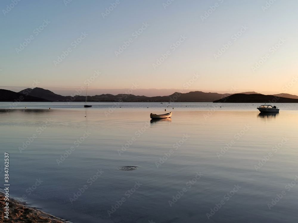 Sunset over the sea in the background island and boat. Sunset over the sea in the background island and boat.
