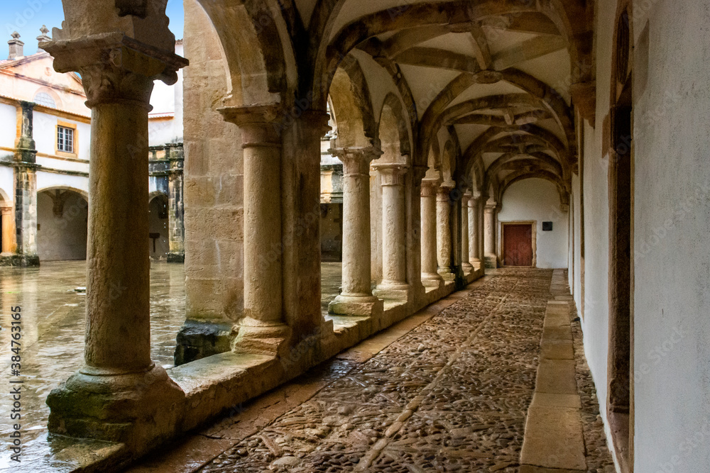 Cloister With Cobblestone Pathway, Columns and Vaulted Ceiling. Templar Castle/Convent Of Christ, Tomar, Portugal.