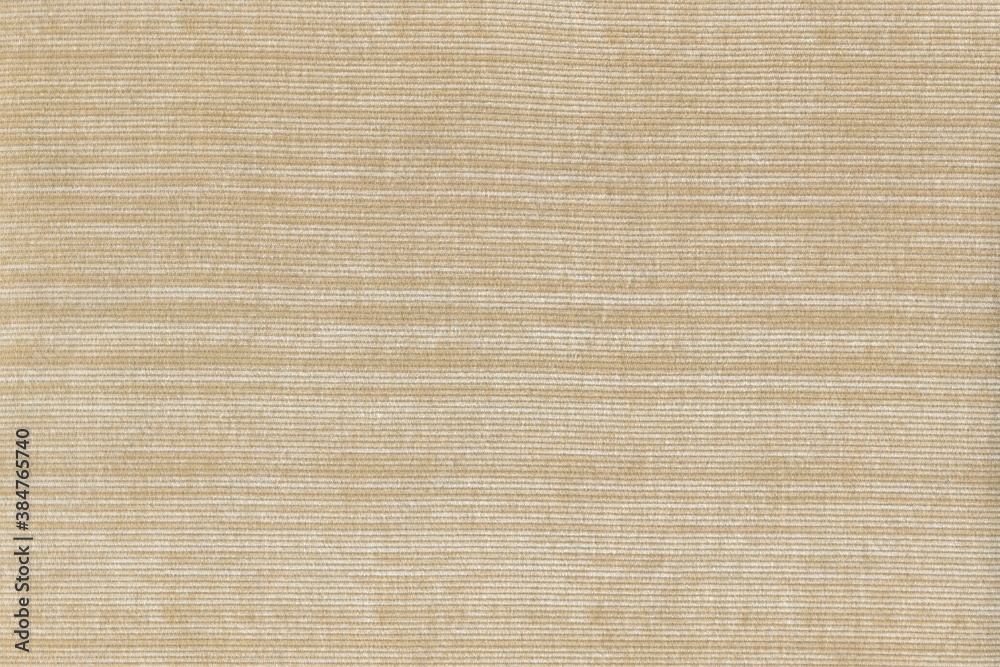 Beige corduroy texture with light stripes. Natural cotton, corduroy. Abstract background of coarse fabric. Beige corduroy texture with light stripes. Natural cotton, corduroy. Abstract background of coarse fabric.