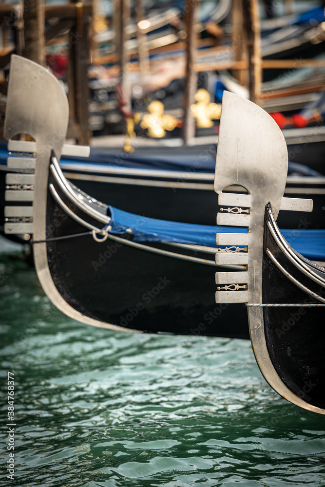 Venice, close-up of two Gondola prows, typical Venetian rowboat, Canal Grande, UNESCO world heritage site, Veneto, Italy, Europe.