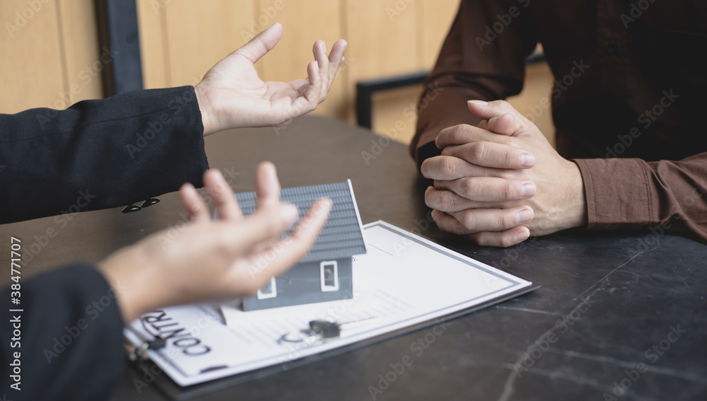 house salesperson or house rental is talking to customers to negotiate
