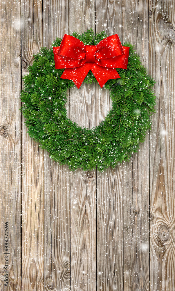 Christmas wreath red ribbon bow falling snow Christmas wreath red ribbon bow falling snow