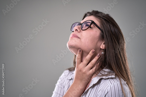 Young businesswoman with sore throat