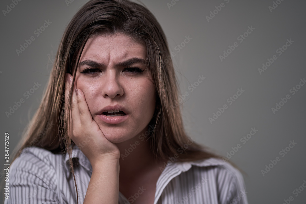 Young woman with tooth ache, in severe pain Young woman with tooth ache, in severe pain