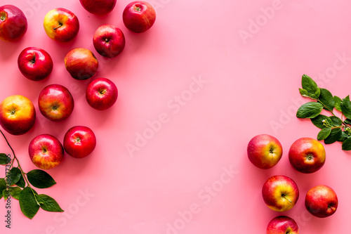 Frame of red apples with green leaves top view