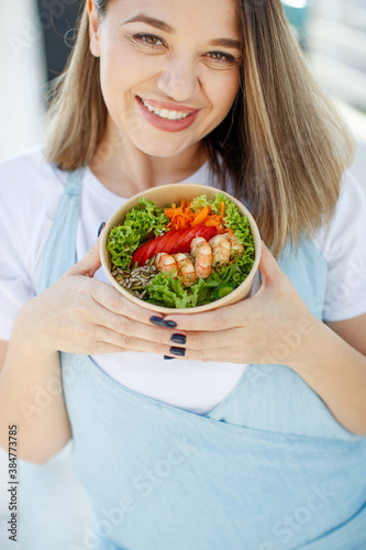 The woman is on the right diet. Fat woman eats salad. High quality photo.