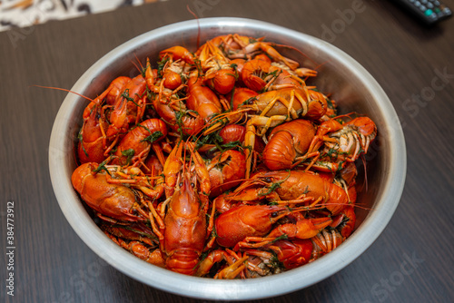 Large bowl of fresh boiled crawfish with dill from above