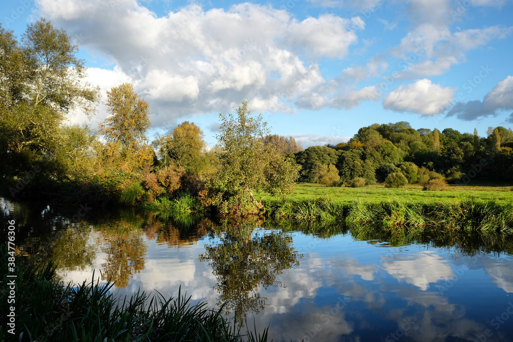 Evening sun on the River Wey, Godalming, Surrey, during the Autumn Evening sun on the River Wey, Godalming, Surrey, during the Autumn