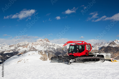 Red snowcat ratrack mountain panorama