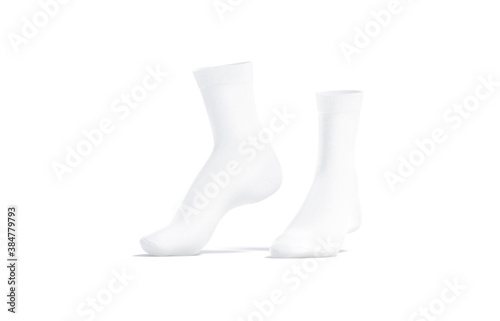 Obraz na płótnie Blank white long socks mockup pair on tiptoe, side view