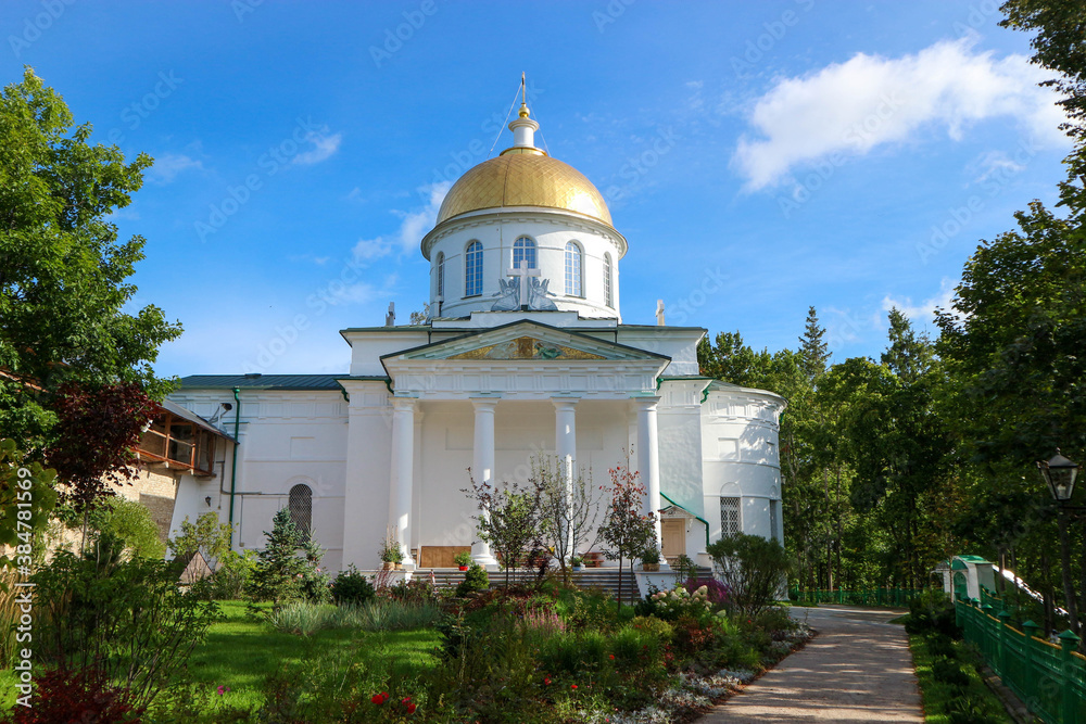 St. Michael's Cathedral in Pskov-Pechory Monastery in Pechory, Pskov region, Russia under blue sky St. Michael's Cathedral in Pskov-Pechory Monastery in Pechory, Pskov region, Russia under blue sky