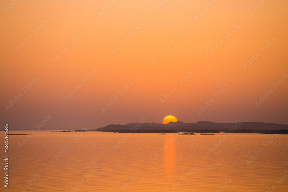 Sun sets behind hills on Lake Nasser