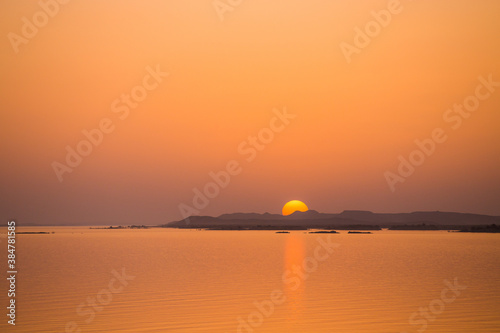 Sun sets behind hills on Lake Nasser