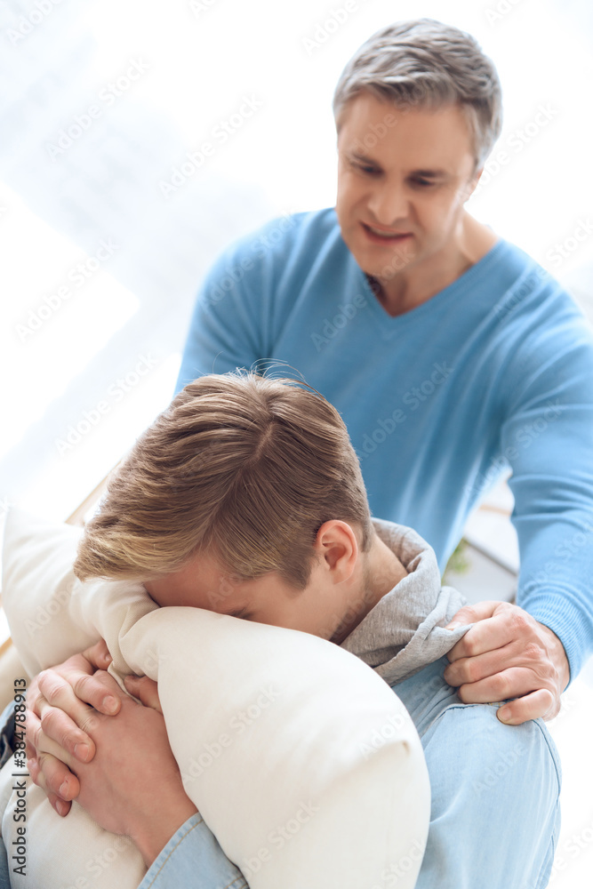 Father tries to apologize to his son. Father tries to apologize to his son.