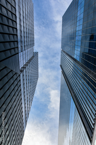 Blue sky visible between two high rises © Sean Davis