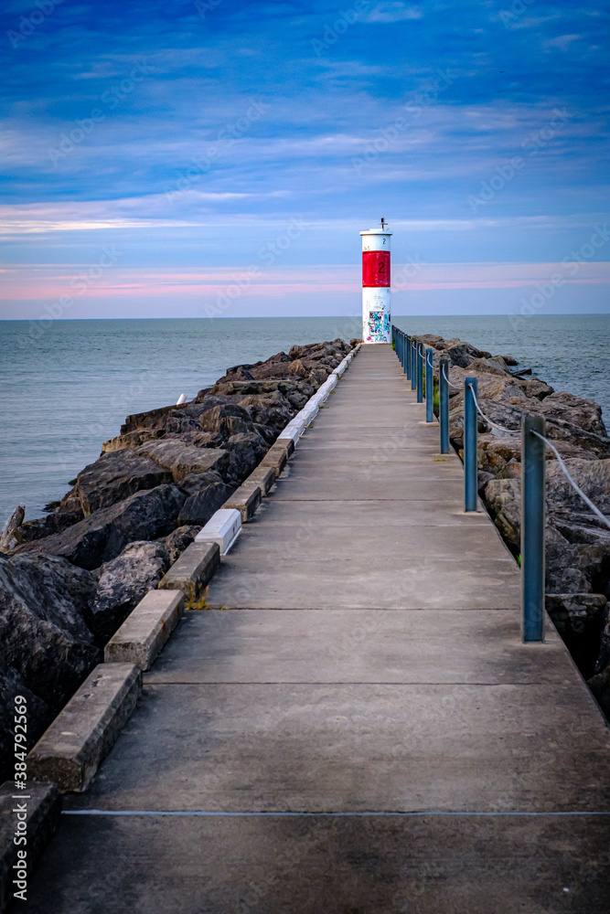Pier on a Lake with lighthouse graffiti Pier on a Lake with lighthouse graffiti