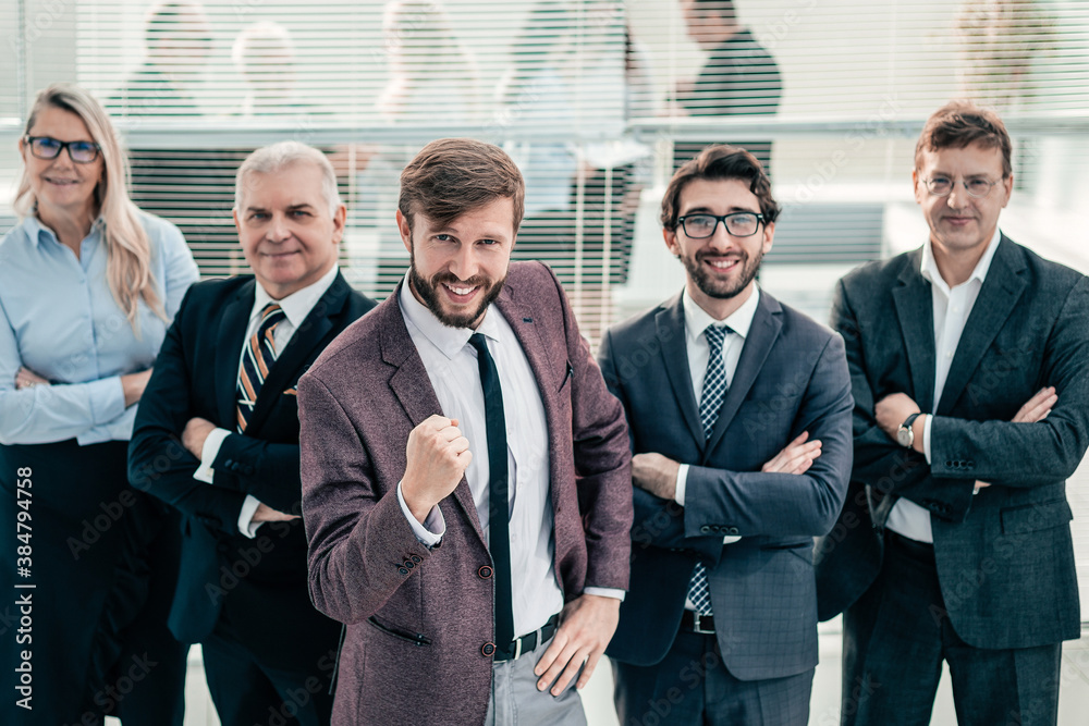 happy businessman and a group of leading experts standing toget happy businessman and a group of leading experts standing toget