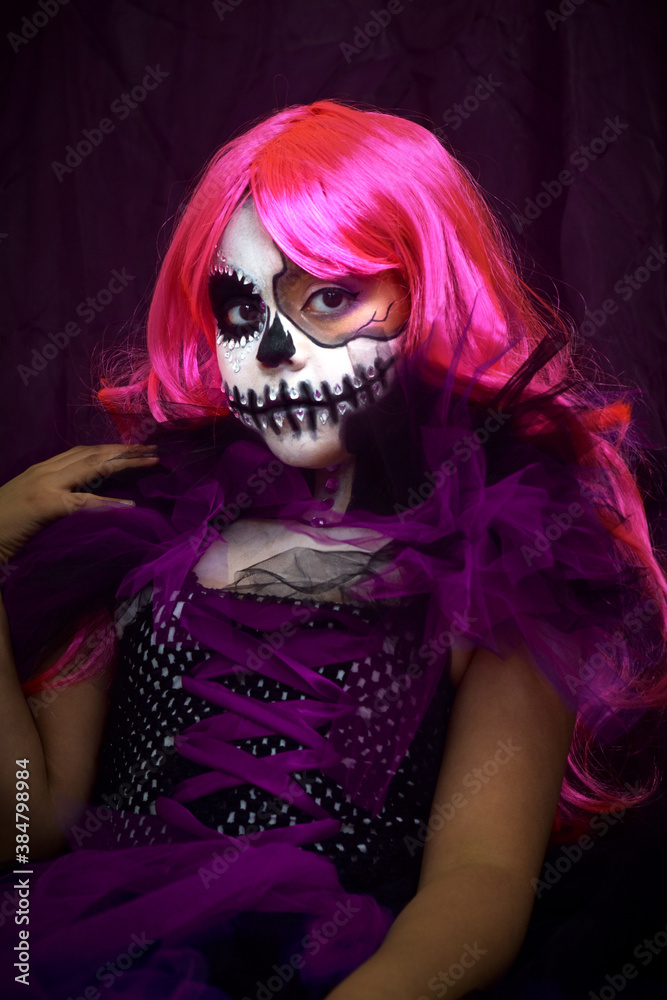 young girl modeling with halloween make up, skeleton day of the deaths, skull girl.